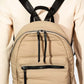 Stylish beige nylon backpack with adjustable straps, ideal for travel and everyday use, showcasing multiple compartments.