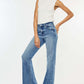 Woman wearing Kancan high-rise wide leg jeans in medium wash with a white top, showcasing stylish comfort and modern flair.