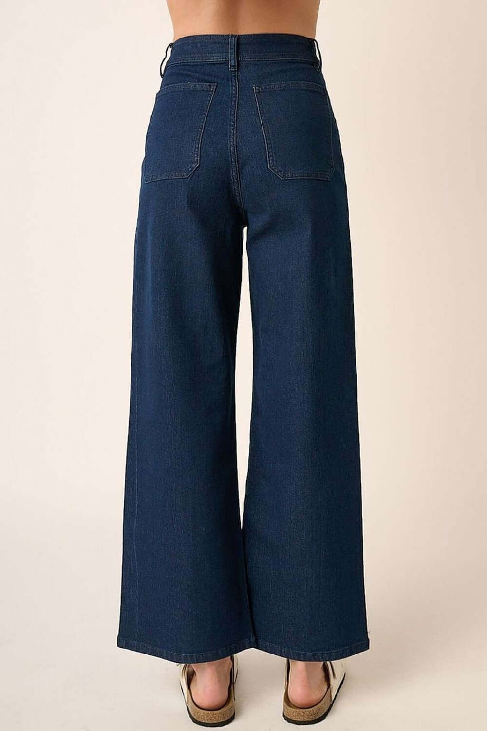 High-waisted wide leg jeans with back patch pockets, showcasing a flattering silhouette in soft denim knit fabric for versatile wear.