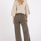 Woman wearing Mittoshop Mineral Wash Elastic Wide Leg Pants with a cozy top, showcasing a relaxed back view and unique vintage look.