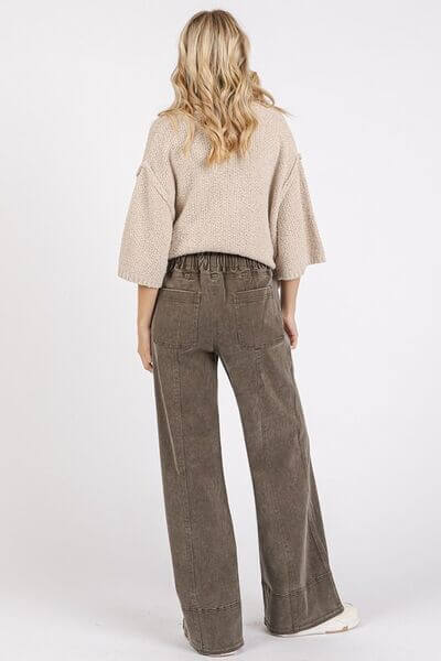 Woman wearing Mittoshop Mineral Wash Elastic Wide Leg Pants with a cozy top, showcasing a relaxed back view and unique vintage look.