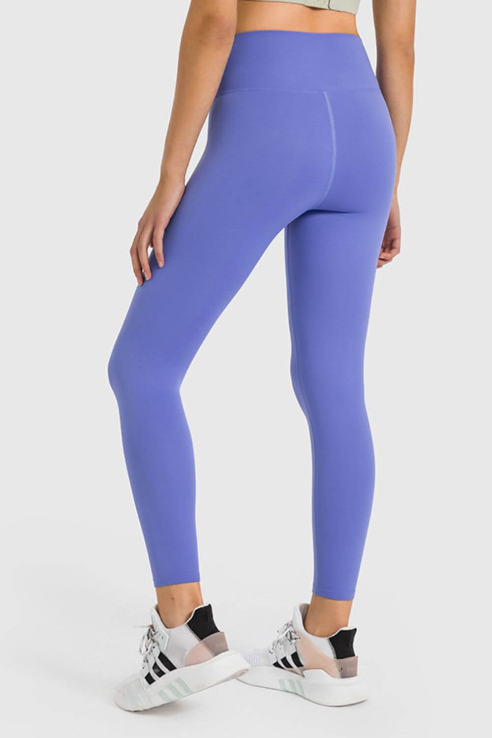 Model showcasing Millennia high waist ankle-length yoga leggings in lavender, perfect for stylish yoga workouts.