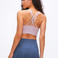 Model showcasing the Millennia Double X Sports Bra in soft lavender, featuring a stylish double X strappy back.