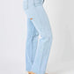 High waist distressed straight jeans by Judy Blue Jeans in light blue denim, featuring ripped details and a flattering cut, paired with tan ankle boots