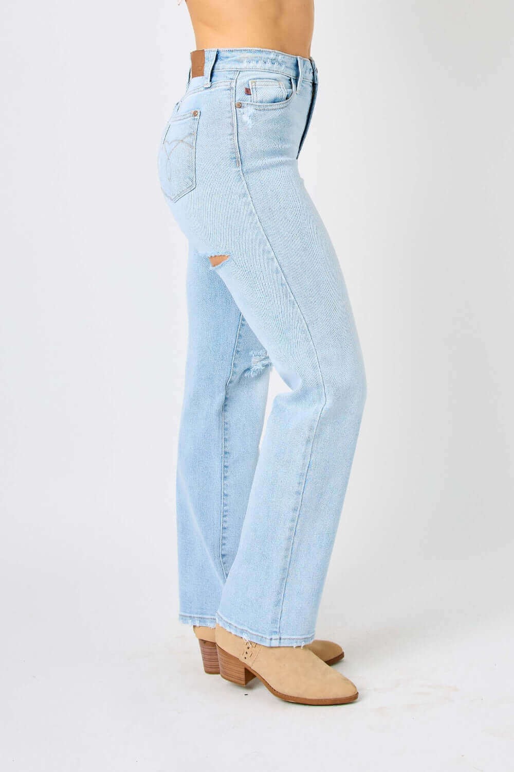 High waist distressed straight jeans by Judy Blue Jeans in light blue denim, featuring ripped details and a flattering cut, paired with tan ankle boots