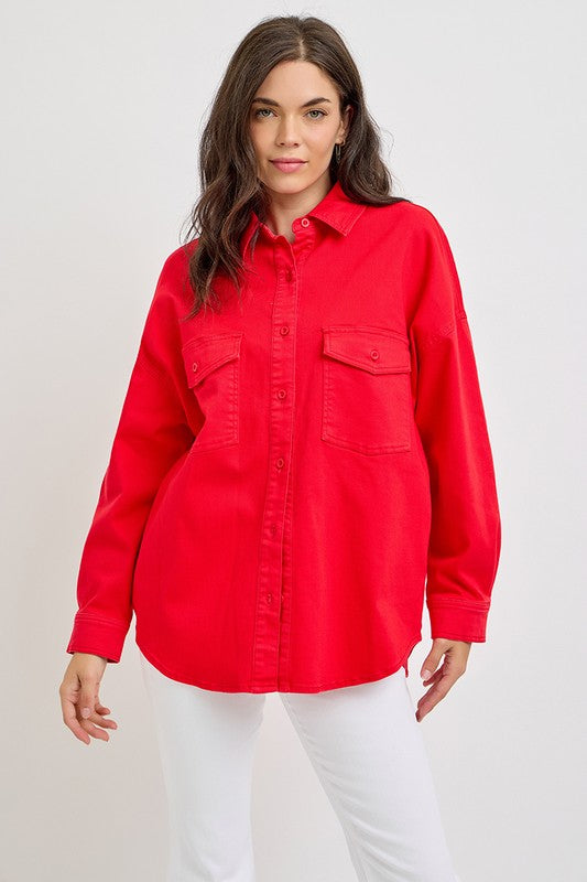 Model wearing a red button-down long sleeve denim shacket with chest pockets, perfect for casual and stylish outfits.