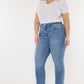 Woman wearing Cat's Whiskers High Waist Jeans with vintage detailing and a flattering silhouette, paired with a white tee and black ankle boots.