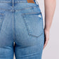 Back view of Judy Blue high waist vintage wash jeans showcasing tummy control and a stylish, flattering fit.