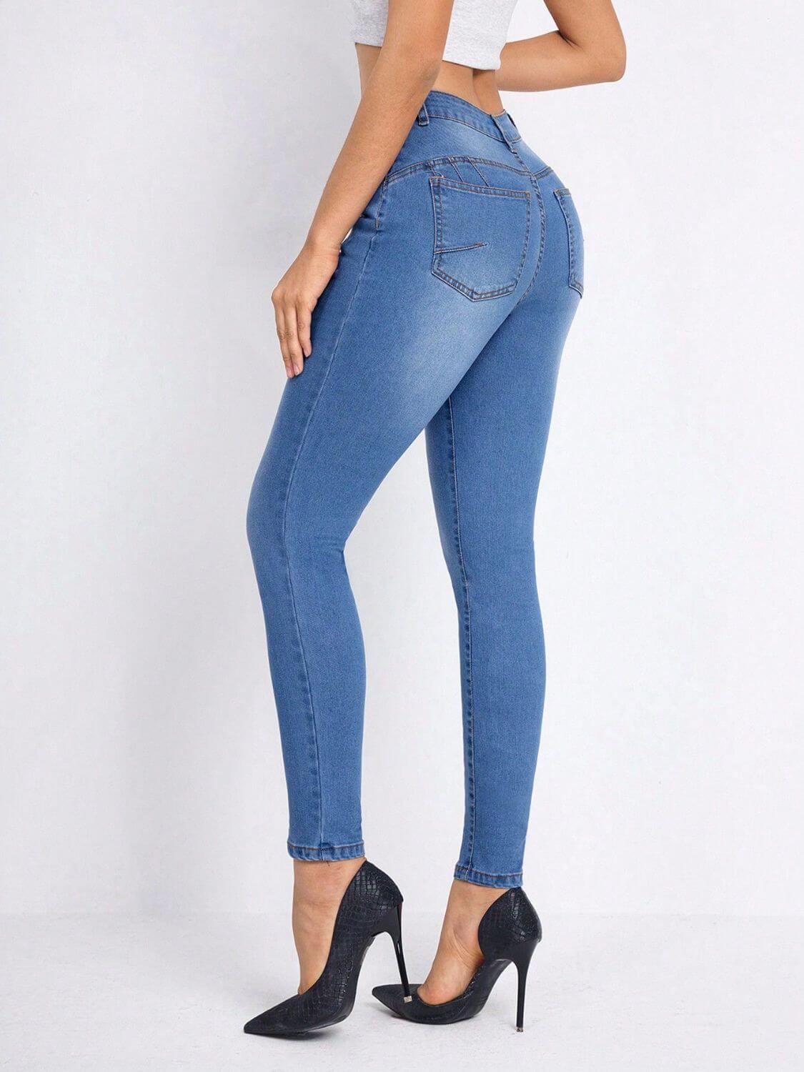 Woman wearing Bella Road High Rise Skinny Jeans with pockets, showing the back view, paired with high heels for a stylish look