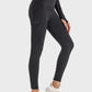 Millennia wide waistband sports leggings with pocket, modeled in black, paired with white sneakers for an active look.