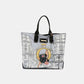 Stylish Nicole Lee USA reversible handbag with chic city print and black handles, perfect for versatile fashionista looks.