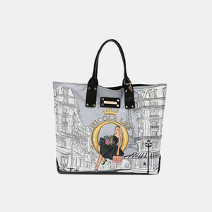 Stylish Nicole Lee USA reversible handbag with chic city print and black handles, perfect for versatile fashionista looks.