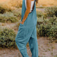 DOUBLE TAKE Full Size V-Neck Sleeveless Jumpsuit with Pockets at Bella Road