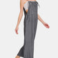 Trendy woman in washed adjustable strap wide leg denim overalls, styled for a casual chic look.