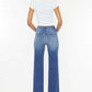 Woman modeling Ultra High Waist Gradient Flare Jeans from the back, showing flattering fit and unique gradient design