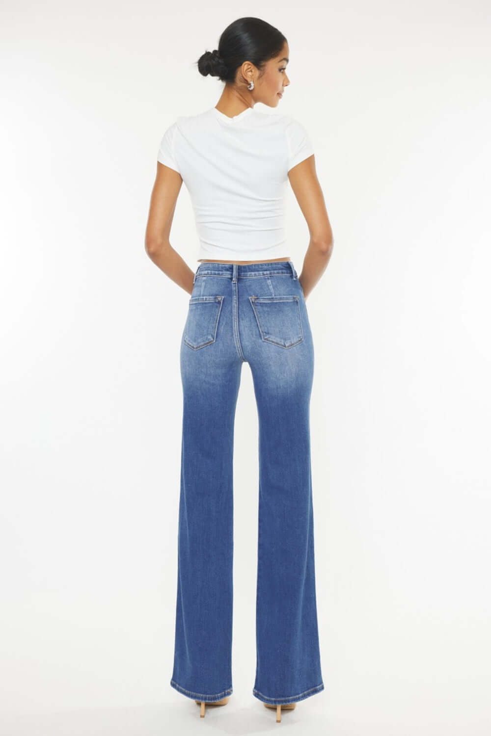 Woman modeling Ultra High Waist Gradient Flare Jeans from the back, showing flattering fit and unique gradient design