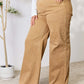 Wide-leg fringe hem Risen Jeans in tan, featuring a high-waisted fit and slightly stretchy material for a flattering, versatile look.