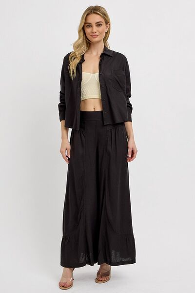 Model wearing RISEN Shirring Detail Wide Leg Pants paired with a black shirt for a chic and elegant look.