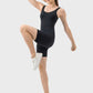 Model showcasing the Millennia Wide Strap Active Romper in black, demonstrating comfort and flexibility during an active pose.