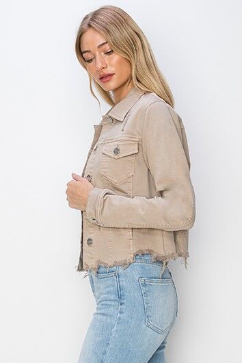 Model wears RISEN Plus Size Cropped Denim Jacket with raw hem, showcasing stylish button-up design in a modern look.