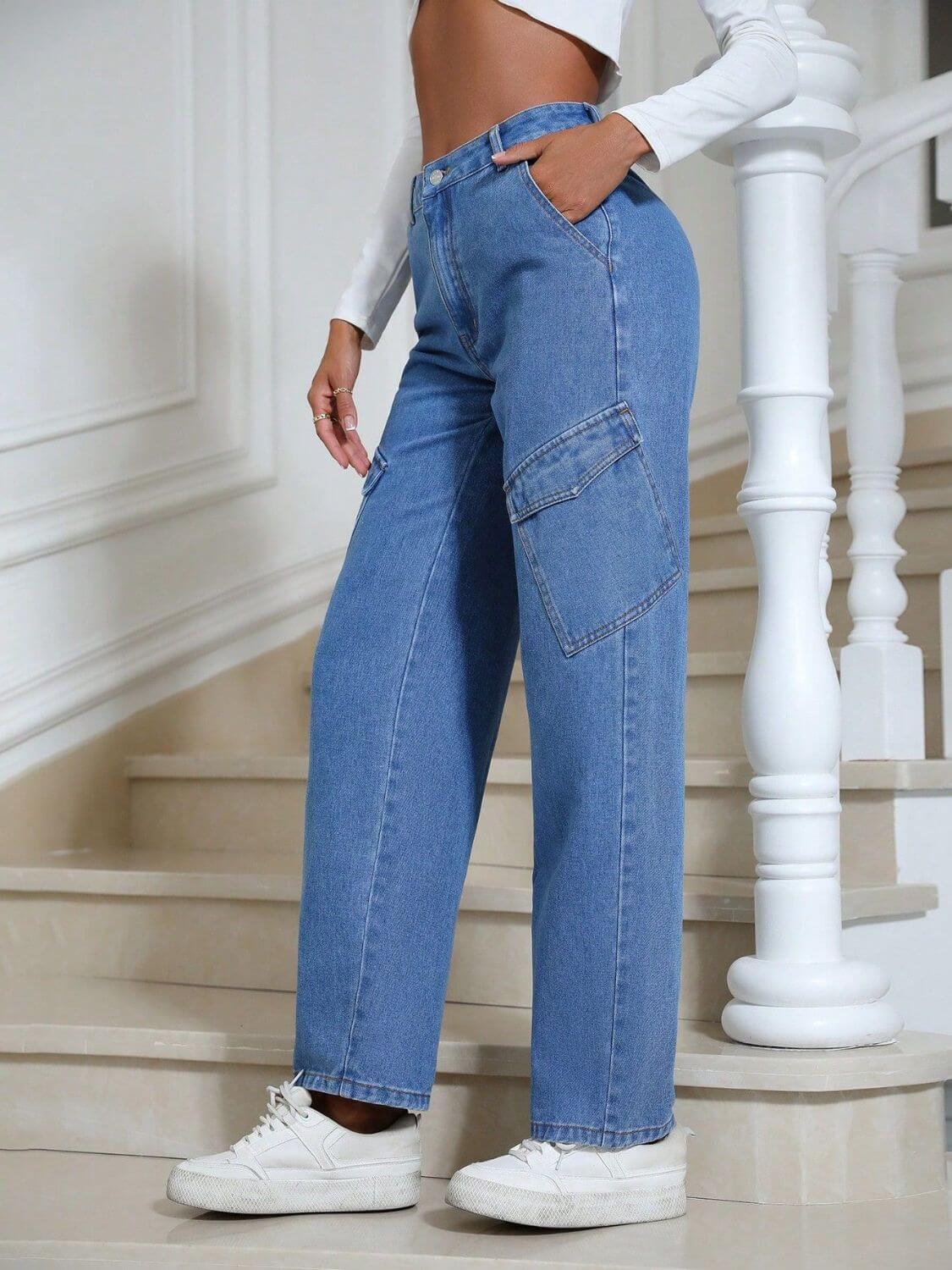 Woman wearing Bella Road High Waist Straight Leg Jeans with Pockets standing on stairs in white sneakers.