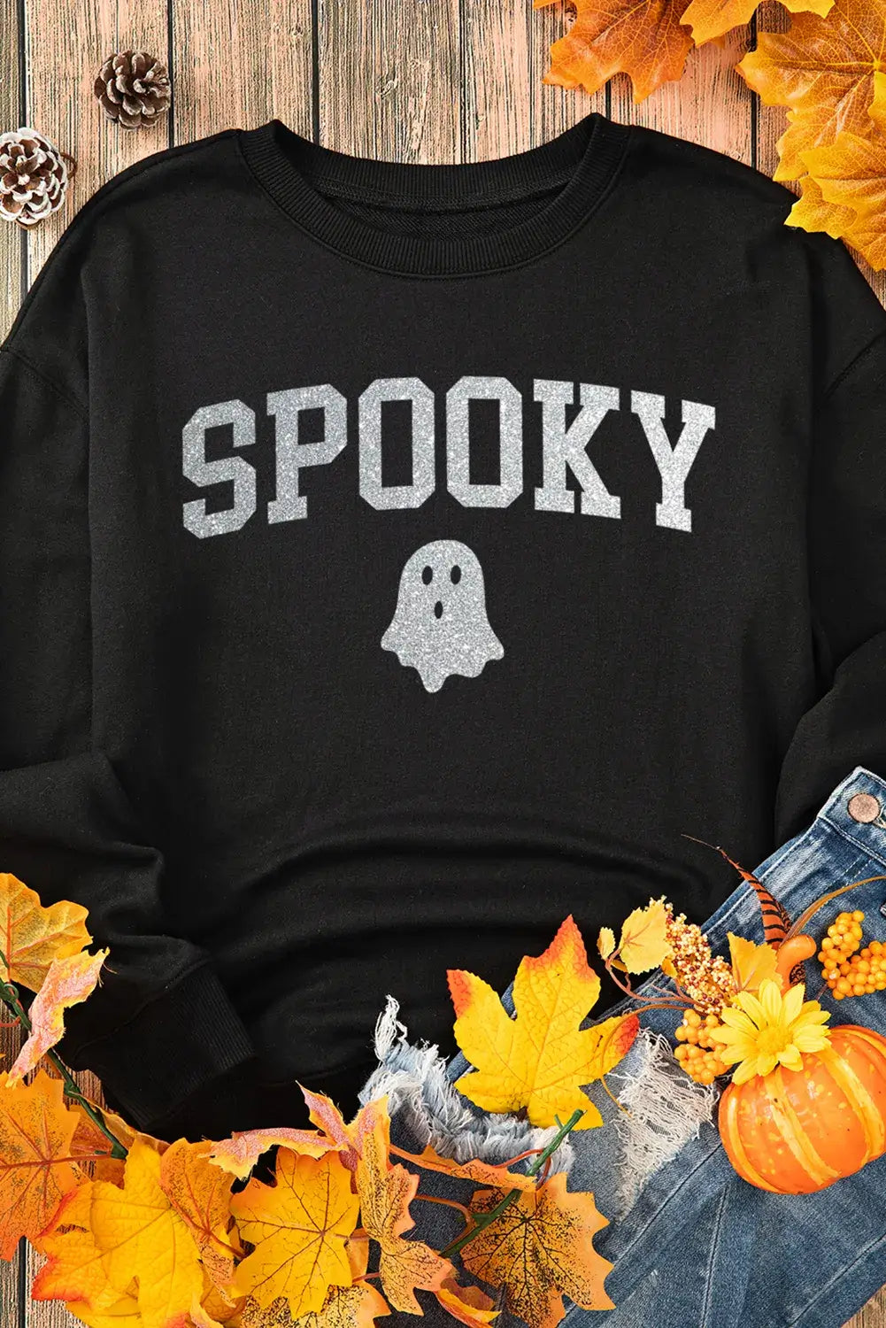 "Bella Road SPOOKY sweatshirt on autumn leaves, showcasing cute ghost design, perfect for cozy spooky occasions"