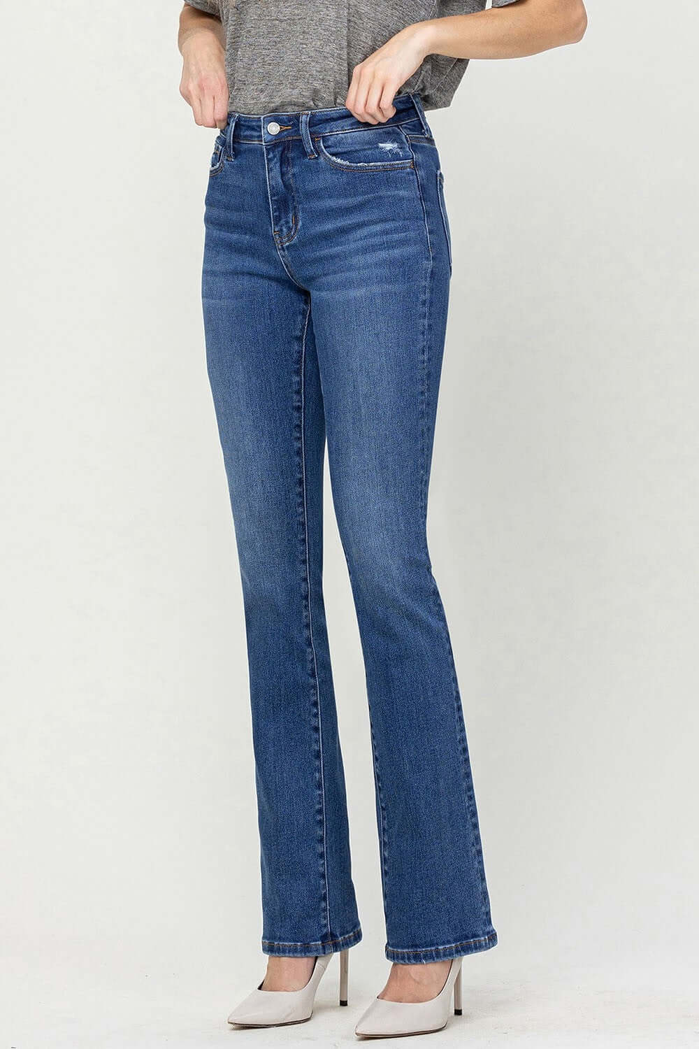 High Waist Bootcut Jeans in blue denim, showcasing a slimming, elongating silhouette perfect for both casual and formal outfits.