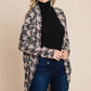 Woman wearing BOMBOM Houndstooth Open Front Cocoon Knit Cardigan over black turtleneck and jeans, showcasing stylish cozy outfit.