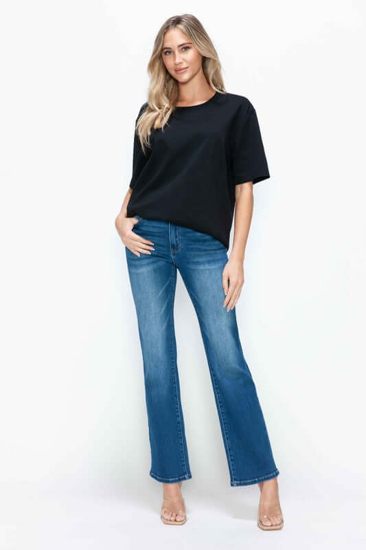 Model wearing bytos Cat's Whiskers High Rise Straight Jeans with a black top, showcasing a stylish and modern outfit.