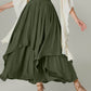 Army green Bella Road skirt with smocked waist and ruched layers, paired with flowy white blouse and strappy sandals.