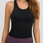 Millennia Round Neck Racerback Active Tank in black, perfect for workouts with removable padding and stylish comfort.