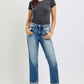 Woman wearing RISEN High Rise Crop Straight Roll Up Jeans paired with a simple tee, showcasing a casual and stylish look.