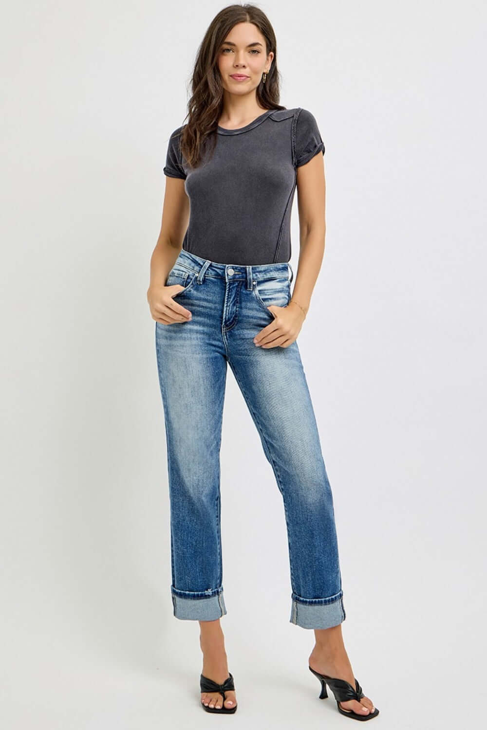 Woman wearing RISEN High Rise Crop Straight Roll Up Jeans paired with a simple tee, showcasing a casual and stylish look.