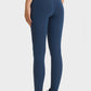 Model wearing Millennia Ultra Soft High Waist Leggings in navy, showcasing a flattering fit with an elastic waistband.