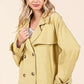 Double-breasted long sleeve trench coat jacket in soft yellow, perfect for transitional weather and stylish layering.