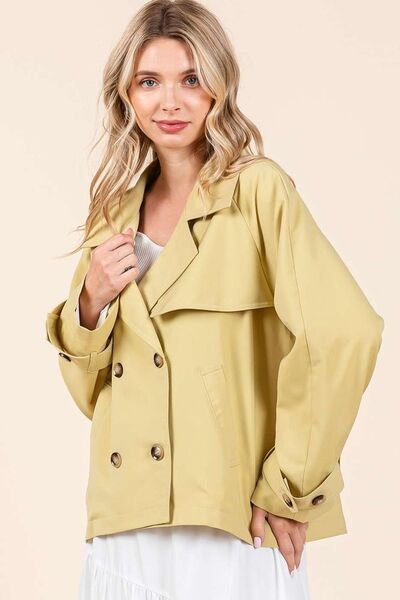 Double-breasted long sleeve trench coat jacket in soft yellow, perfect for transitional weather and stylish layering.