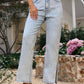 Bella Road side slit straight leg jeans in light wash, styled with pockets, perfect for casual outings.