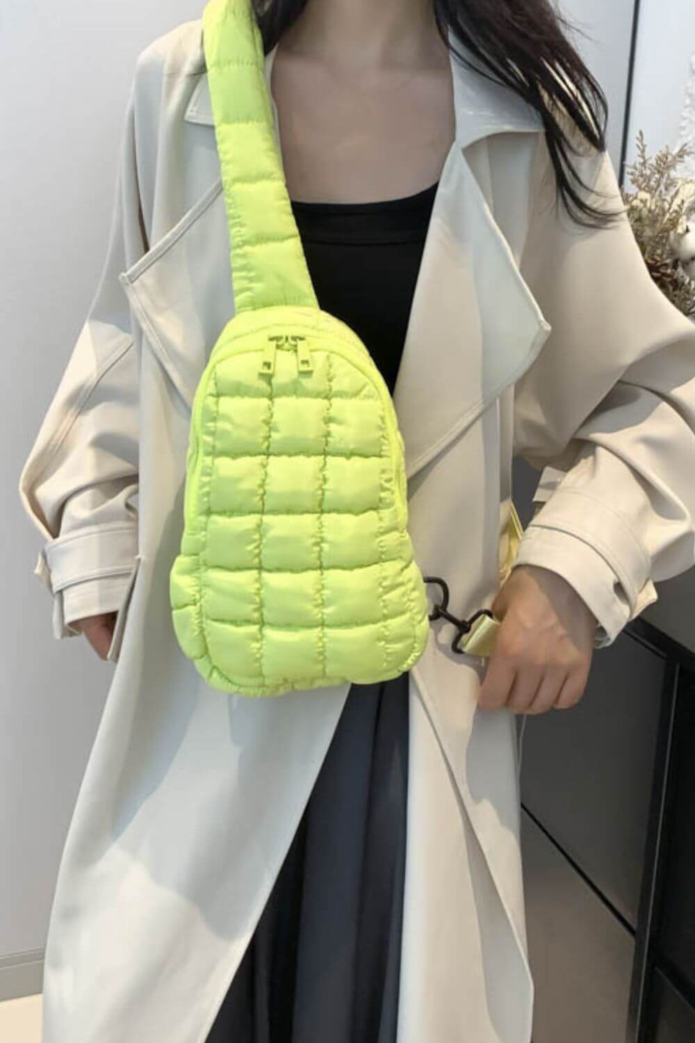 Stylish lemon yellow quilted crossbody bag on woman in chic trench coat, perfect for trendy outfits and everyday adventures.