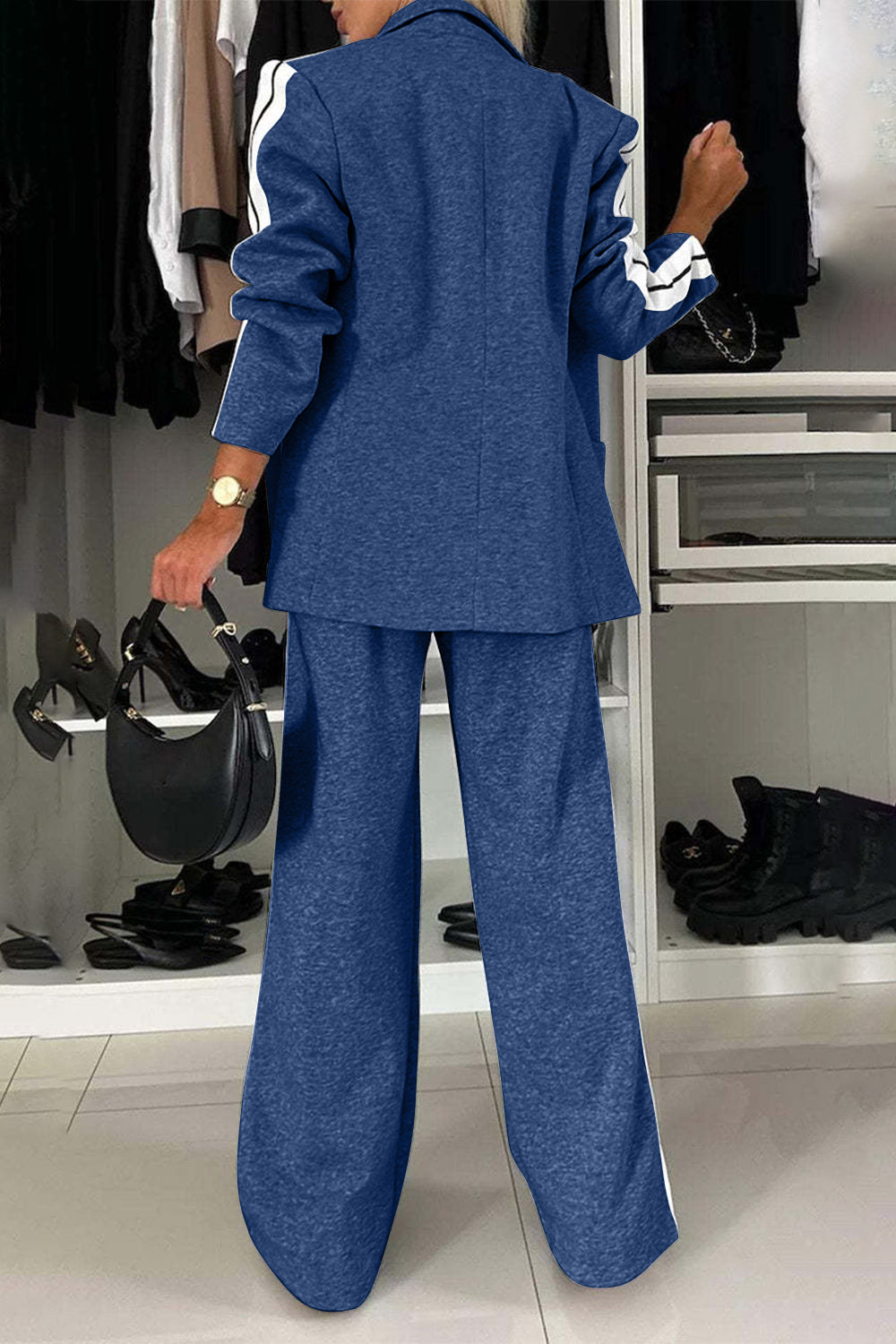 Stylish woman in Bella Road denim top and pants set, showcasing contrast lapel collar and chic pockets from behind.