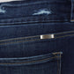 Close-up of Cat's Whiskers Raw Hem High Waist Jeans showcasing raw hem detail and back pocket.