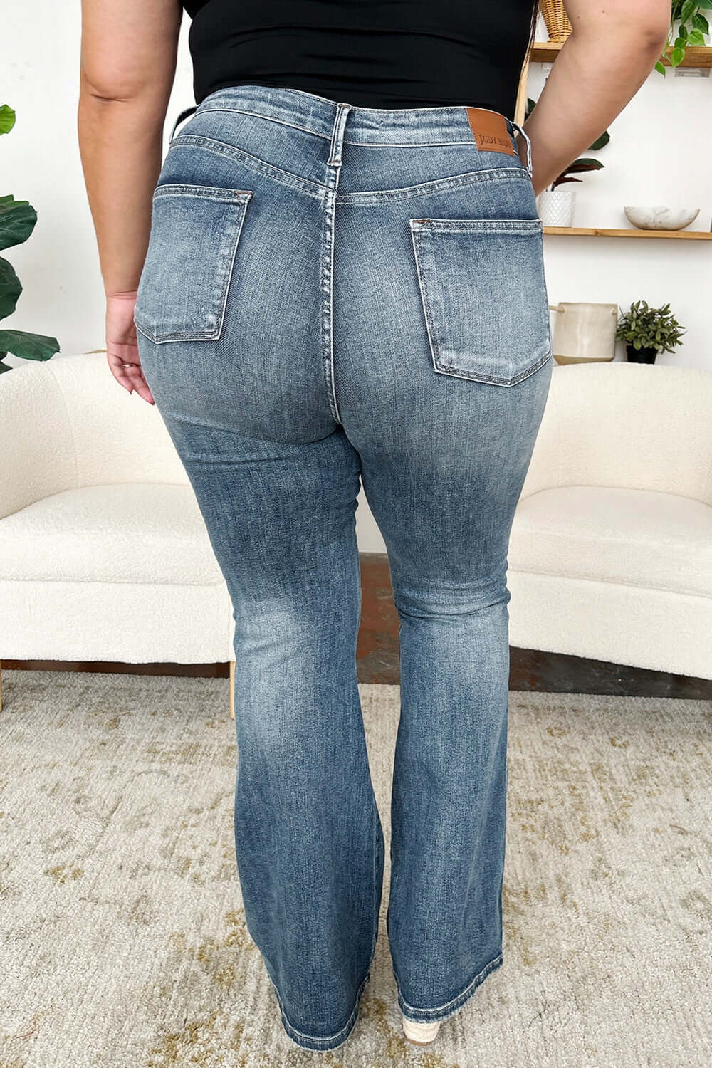 Back view of High Waist Tummy Control Flare Jeans by Judy Blue Jeans showing the flare leg design.