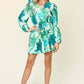 DOUBLE TAKE Full Size Floral Long Sleeve Romper with Pockets at Bella Road