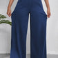 Women's wide leg jeans with pockets in blue, showcasing a relaxed fit and stretch fabric for comfort and style.