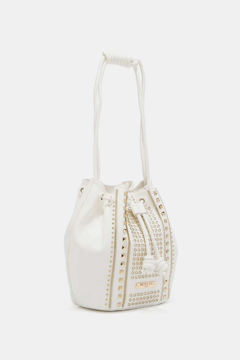 Nicole Lee USA Amy Studded Bucket Bag made from pebbled vegan leather with stud and zipper detailing, drawstring closure, and metal feet.