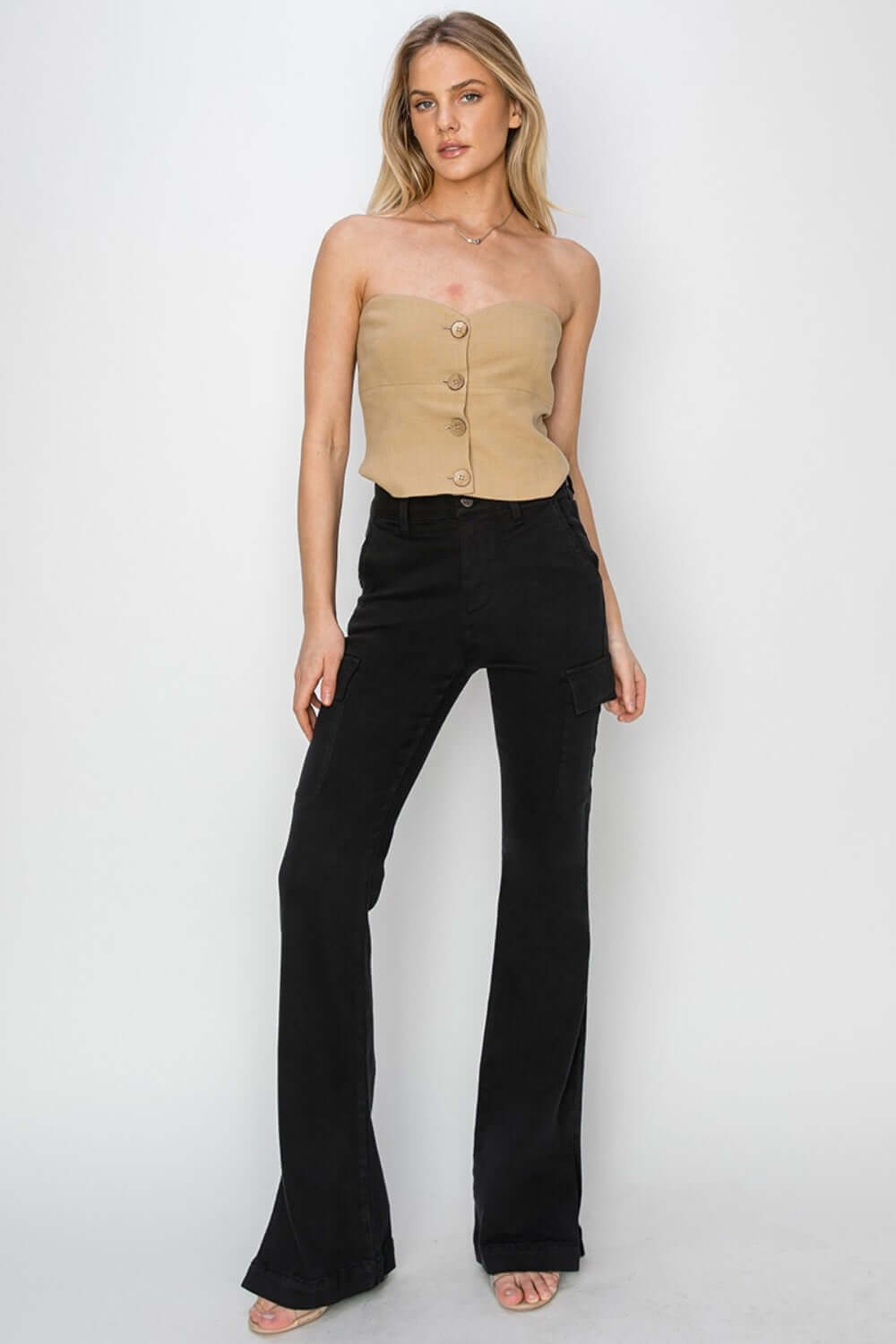 Risen Jeans High Rise Side Slit Cargo Bootcut Jeans in black modeled with a beige top