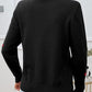 Woman wearing Devine Lace Detail Heart Long Sleeve Sweater in black, showing back view with lace collar, long sleeves, and heart details.