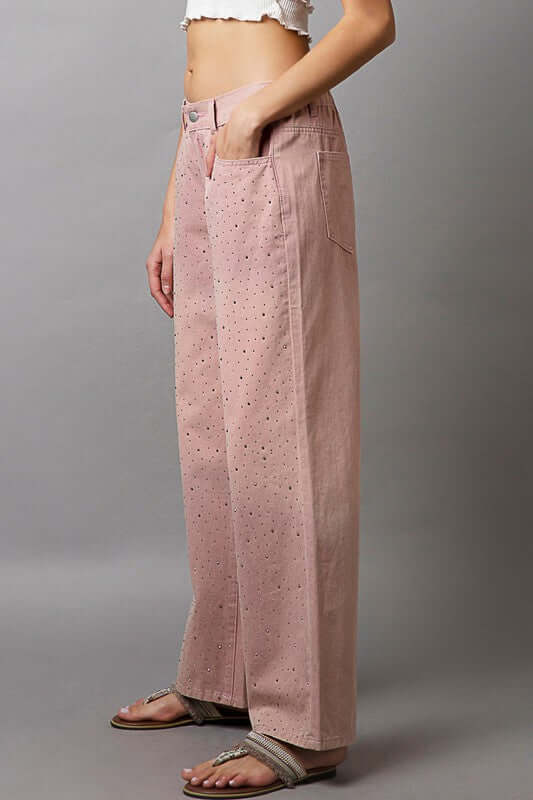 Stylish gradient wide leg pants showcasing decorative details and a relaxed fit, perfect for making a fashion statement.