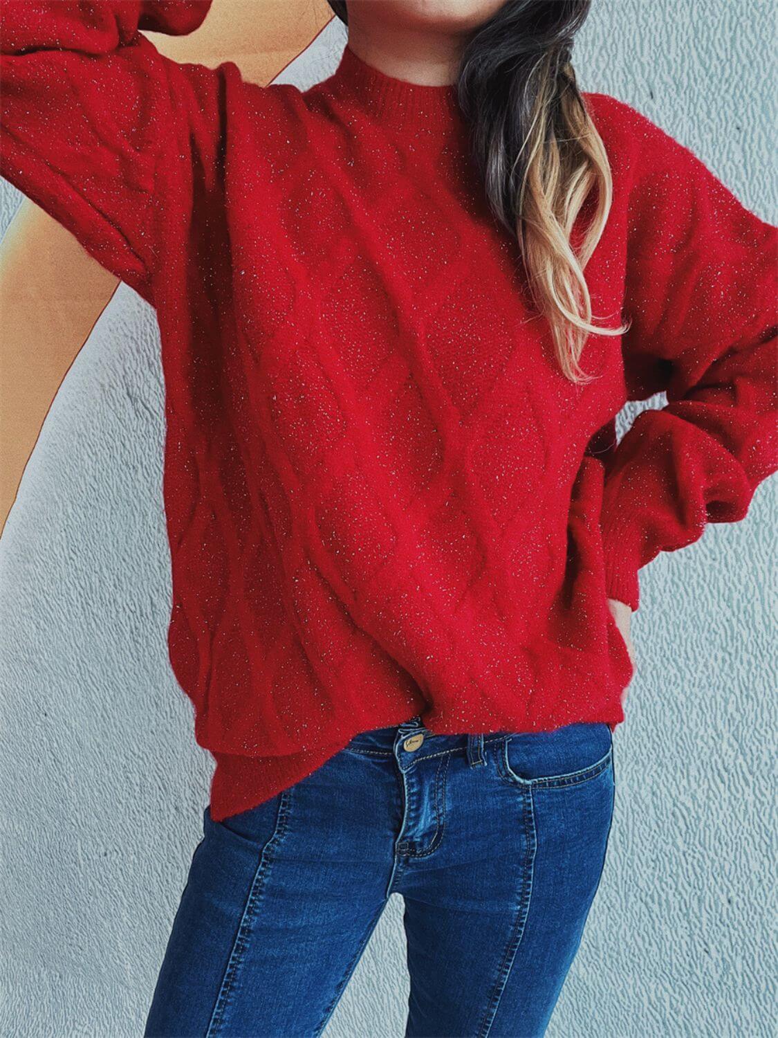 Bella Road Diamond Round Neck Long Sleeve Sweater in red, featuring a unique diamond pattern, worn with blue jeans for a stylish look.