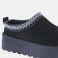 Stylish black slip-on boot with embroidered trim and platform sole.