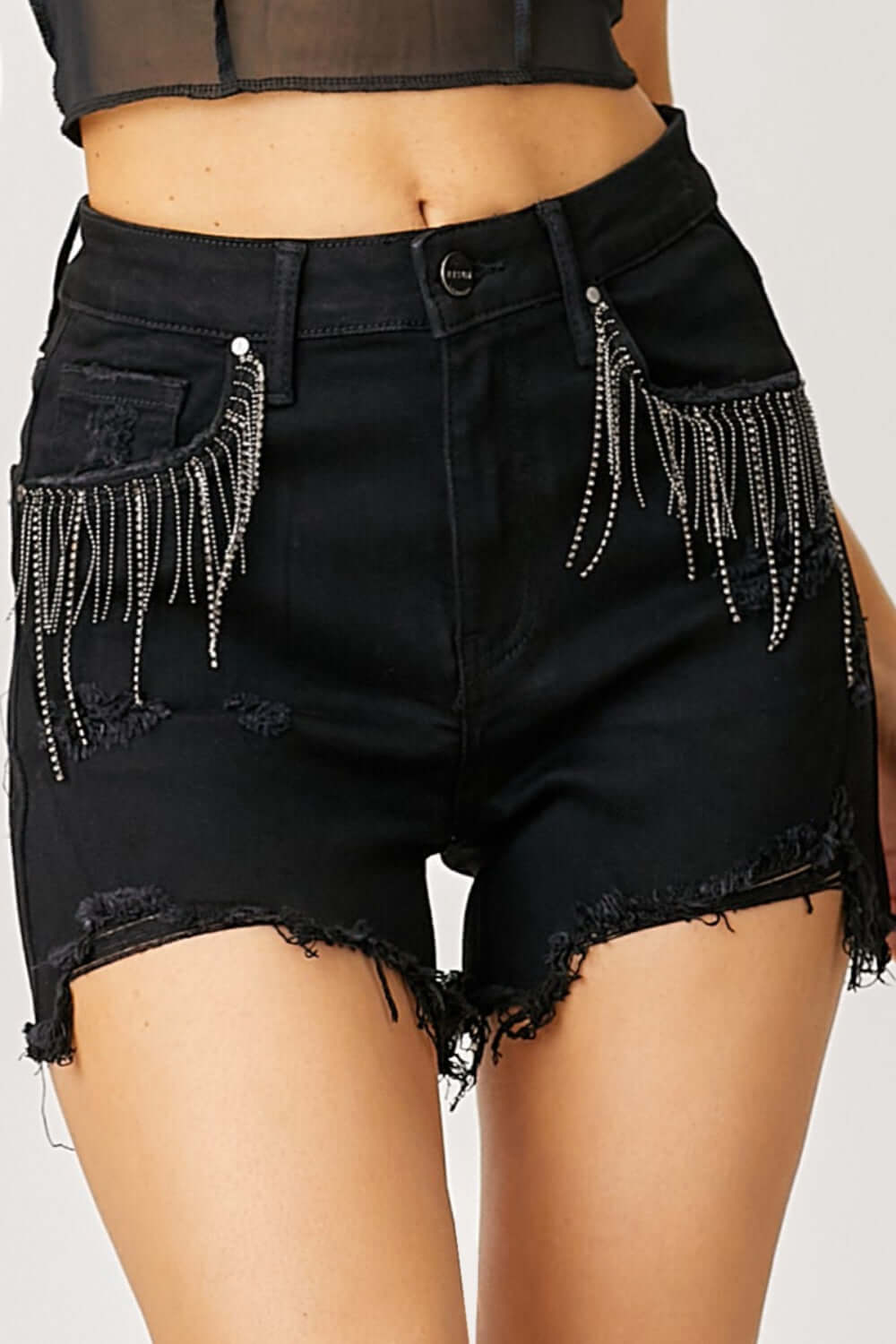 Frayed hem denim shorts with fringe detail pockets by Risen Jeans, perfect for summer fashion and casual chic look.